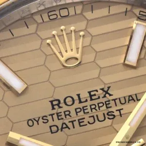 Close-up of champagne dial with diamond hour markers