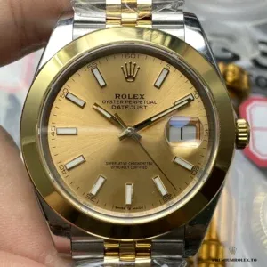 Close-up of champagne dial with diamond hour markers on the 126203