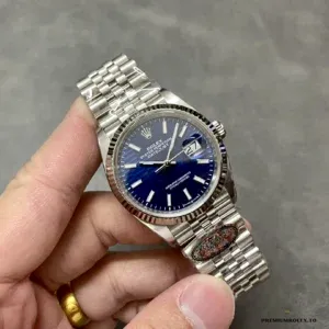 Datejust 126234 blue dial under direct light revealing radial grain texture