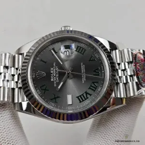 Close-up of the rhodium grey sunburst finish and luminescent hour markers