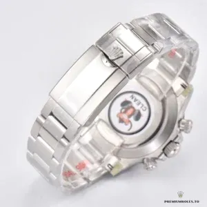 Rolex Daytona 116520 displayed on grey suede watch cushion