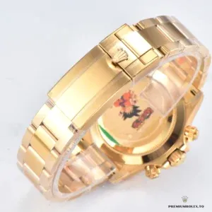 Close-up of mother of pearl dial with diamond markers on gold Daytona