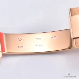 Close-up of chocolate dial with rose gold subdials and markers