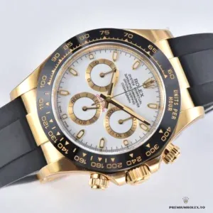 Daytona 116518LN with white dial, gold-plated case and black rubber strap, three-quarter studio shot