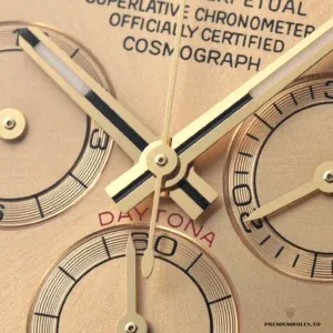 Tachymeter bezel and gold-plated case at an angle on the Daytona