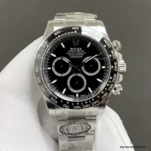 Daytona 126500LN with black dial and silver-ringed subdials, held in a white glove