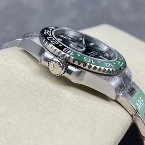 Close-up of black dial with luminescent markers and date window