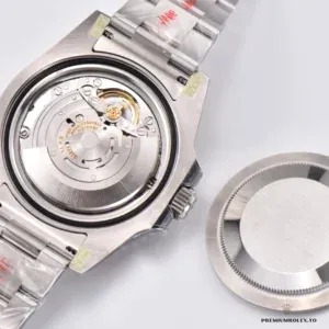 GMT-Master II 116710LN with the caseback removed, showing its automatic movement and rotor