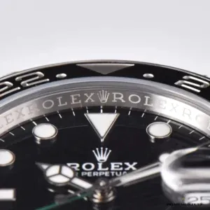 Rehaut engraving around a black GMT-Master II 116710LN dial, seen through the crystal