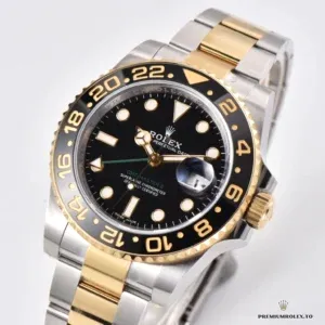 Crown guards and screw-down crown in yellow gold plating on the GMT-Master case
