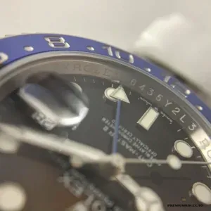 Full watch and bracelet of the Batman BLNR on flat surface