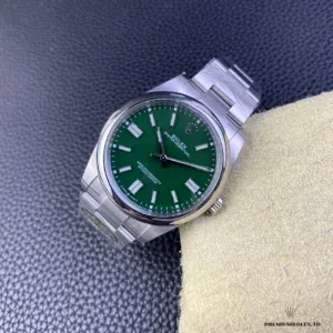 Oyster Perpetual 124300 overhead showing clean symmetrical no-date dial