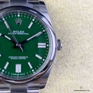 Rolex Oyster Perpetual 124300 green dial displayed on watch cushion