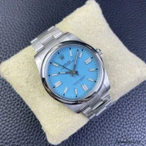 Close-up of blue sunburst dial with applied steel hour markers