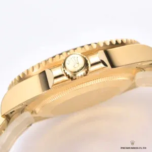 Date window and Cyclops magnification on the black gold Submariner