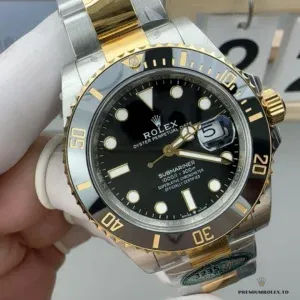 Crown guard and screw-down crown detail on the two-tone Submariner