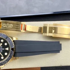 Close-up of bidirectional bezel with raised gold numerals on black ceramic