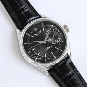 Close-up of black lacquer dial with polished white gold markers