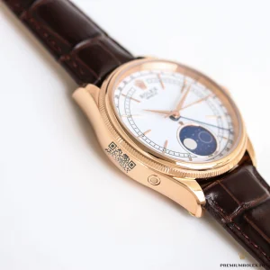 Blue enamel moon phase display on white dial background
