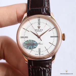 Fluted double bezel catching light on rose gold-plated case