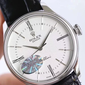 Domed sapphire crystal reflecting light on the white Cellini dial