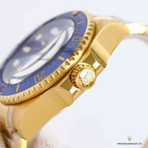 Ceramic bezel with gold surround and luminous pip at twelve