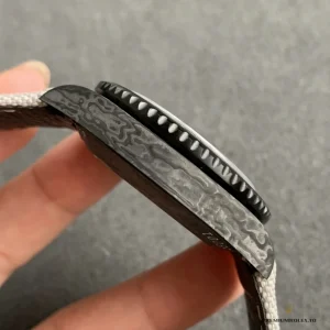 Wrist shot of All-Carbon DiW GMT on black nylon fabric strap