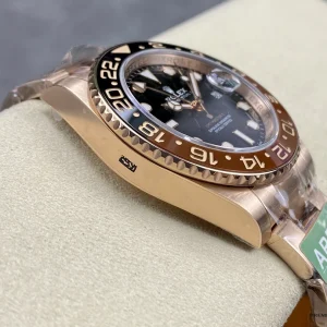 Side profile of Rootbeer GMT showing rose gold-plated case and crown guards