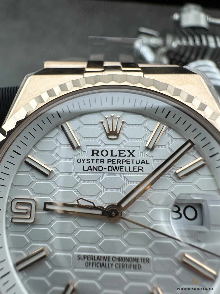 Close-up of the 127335 honeycomb dial and date window at three