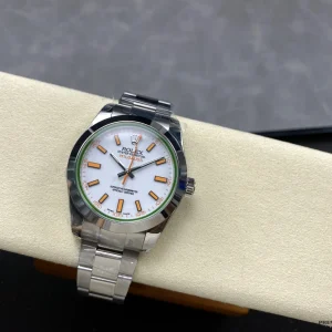 Rolex Milgauss 116400 white dial flat lay on dark background
