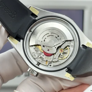 Overhead angle of Milgauss GV dial through green sapphire crystal