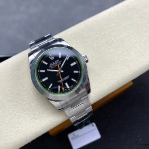 Detail of orange rectangular hour markers on black Milgauss dial