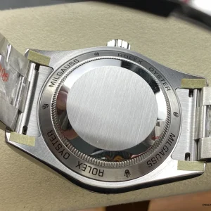 Side profile of the blue Milgauss showing steel case and smooth bezel