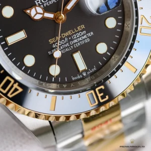 Black dial with gold-outlined indices and Mercedes hands on 126603