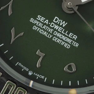 Overhead angle showing full green dial and ceramic bezel assembly