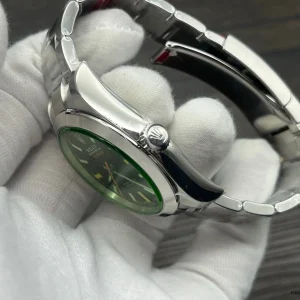 Milgauss 116400GV side angle showing orange lightning bolt seconds hand