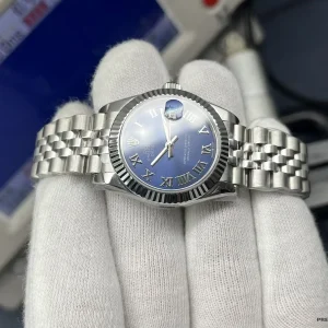 Three-quarter angle showing bezel flutes and Roman numeral spacing
