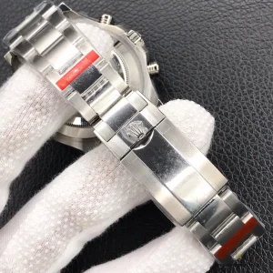 Close-up of white lacquer dial with luminescent hour markers and Mercedes hands