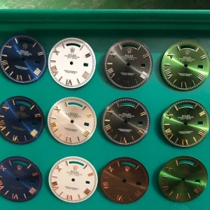 Day-Date platinum-tone dial detail with day window at twelve o'clock