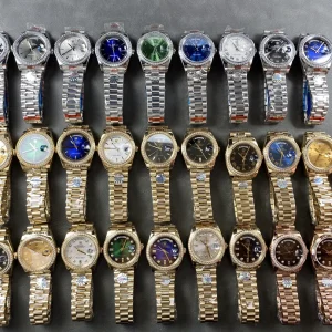Rolex Day-Date on wrist showing platinum-tone finish in natural light