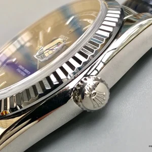Close-up of blue sunburst dial with applied white gold markers