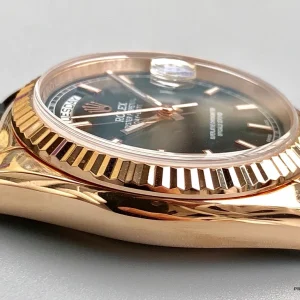 Close-up of black dial with rose gold applied hour markers