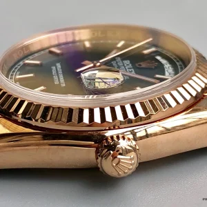 Day-Date 118135 angled view showing rose gold tone and smooth bezel