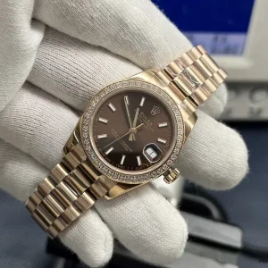 Replica Rolex Lady-Datejust 279135RBR angled view highlighting brown dial sunburst finish