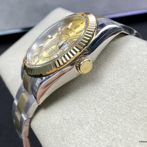 Side view of a two-tone Sky-Dweller 326933 showing the fluted Ring Command bezel and crown