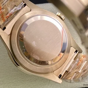 Dial macro of Sky-Dweller 326935 showing brown sunburst and gold indices