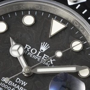 Wrist shot of Submariner Longobarda in daylight showing carbon dial texture