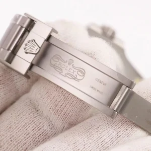 Submariner brown sandblasted dial close-up with applied luminous markers