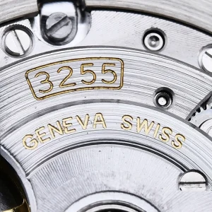 Day-Date M228238 white dial lume shot showing Chromalight glow on markers