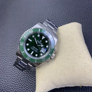 Submariner Hulk lume shot showing green Chromalight glow on indices and hands